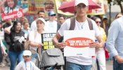 “Don’t mess with my children,” reads a sign carried by a participant in one of some 30 marches on Oct. 19, 2024, in Colombia to protest the country’s health department memorandom that sanctions sex changes for minors.