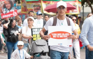 “Don’t mess with my children,” reads a sign carried by a participant in one of some 30 marches on Oct. 19, 2024, in Colombia to protest the country’s health department memorandom that sanctions sex changes for minors. Credit: Eduardo Berdejo/ACI Prensa