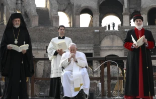 Pope Francis prays during an interreligious peace appeal at the Colosseum in Rome, Oct. 25, 2022. Vatican Media