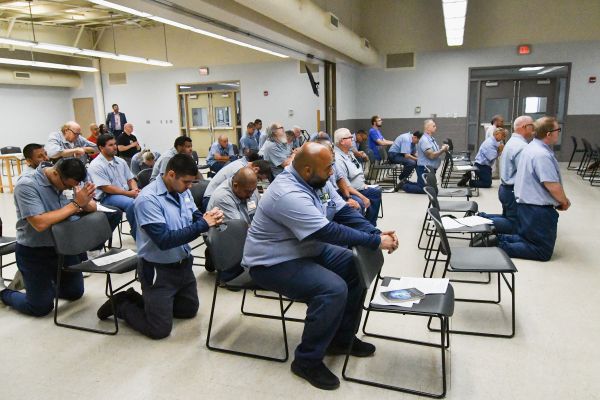 Men spend time in prayer before the Blessed Sacrament at Pickaway Correctional Institution near Columbus, Ohio, on June 28, 2024. Credit: Catholic Times/Ken Snow