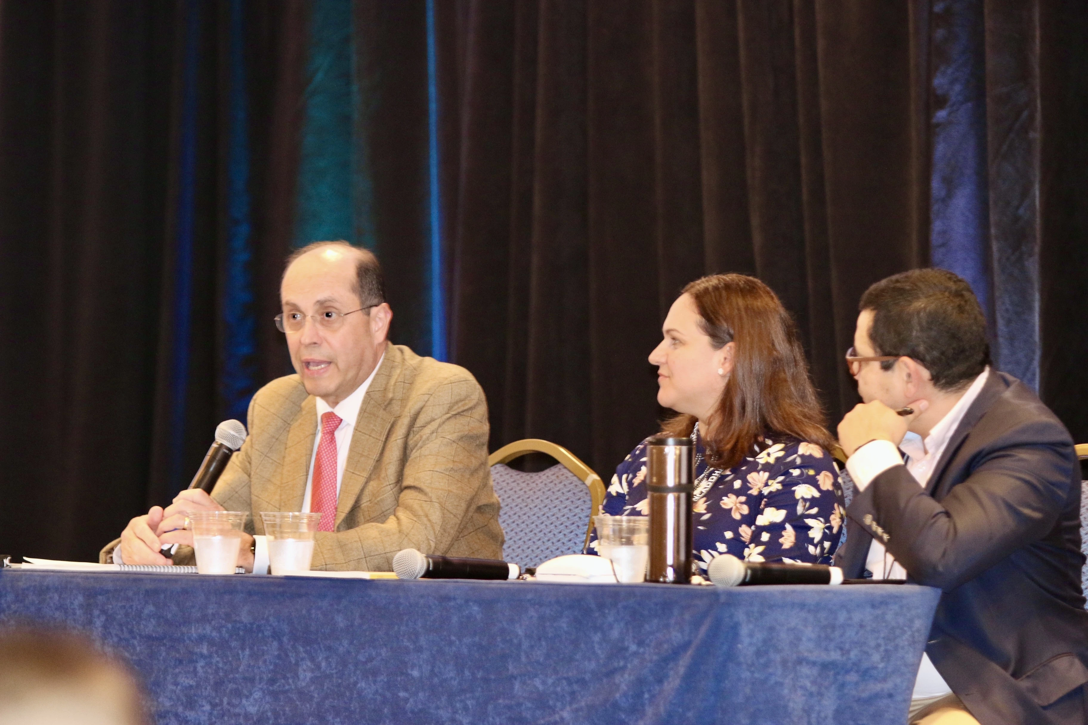 Alejandro Aguilera-Titus (at left), lead staff for Hispanic/Latino Ministry at the United States Conference of Catholic Bishops, speaks during the 2024 Conference of the National Catholic Association of Diocesan Directors for Hispanic Ministry, which took place from Oct. 8–11. Next to him is Lorianne Aubut of the Diocese of Madison, Wisconsin, and Edwin Ferrera of the Archdiocese of Seattle.?w=200&h=150