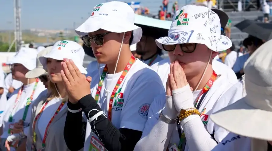 A group of South Koreans pray at World Youth Day 2023 in Lisbon, Portugal.?w=200&h=150