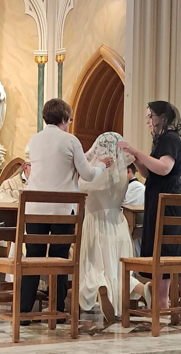 Courtney Ramsdell, a recently ordained virgin from the Diocese of Bridgeport, Connecticut, receives the veil at her ordination. Credit: Laurie Power