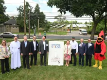 The Catholic University of America President Peter Kilpatrick (next to mascot) with Standard Solar, university, and government leaders on June 3, 2024.