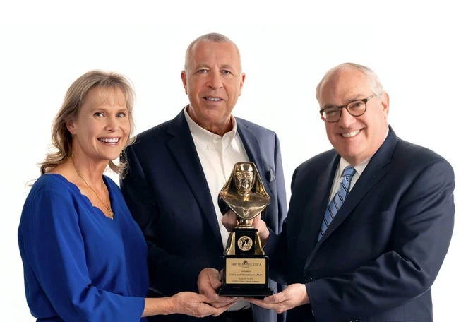 Michael P. Warsaw, chairman and CEO of EWTN Global Catholic Network, presents the 2024 Mother Angelica Award to Curtis and Michaelann Martin, co-founders of the Fellowship of Catholic University Students, on Dec. 12, 2024.?w=200&h=150