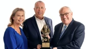 Michael P. Warsaw, chairman and CEO of EWTN Global Catholic Network, presents the 2024 Mother Angelica Award to Curtis and Michaelann Martin, co-founders of the Fellowship of Catholic University Students, on Dec. 12, 2024.