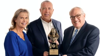 Michael P. Warsaw, chairman and CEO of EWTN Global Catholic Network, presents the 2024 Mother Angelica Award to Curtis and Michaelann Martin, co-founders of the Fellowship of Catholic University Students, on Dec. 12, 2024.