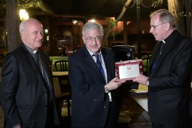 Dale Recinella (C) accepts the Pontifical Academy for Life's Guardian of Life Award from Archbishop Vincenzo Paglia (L) and Cardinal Wim Eijk (R), Sept. 28, 2021.