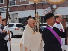 Archbishop Samuel Aquila leads the Eucharistic procession down Colfax Avenue in Denver on June 9, 2024.