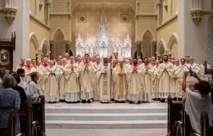 Bishop Jacques Fabre-Jeune poses alongside many of the priests of the Diocese of Charleston, South Carolina, at a recent ordination. The diocese has seen a recent surge in vocations Credit: The Catholic Miscellany/Doug Deas