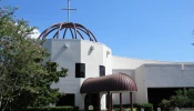 The Diocese of St. Petersburg Pastoral Center, pictured here before the storm, sustained damage and high winds shattered windows.