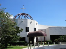 The Diocese of St. Petersburg Pastoral Center, pictured here before the storm, sustained damage and high winds shattered windows.