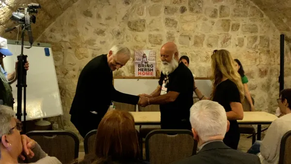 Danny Miran greets Cardinal Matteo Zuppi, archbishop of Bologna, on June 13, 2024, after the meeting between the group of pilgrims led by Zuppi on a visit of solidarity and peace to the Holy Land and some relatives of the Israeli hostages in Hamas' hands. Danny Miran shared his testimony as the father of Omri Miran, who was kidnapped on Oct. 7, 2023, from Kibbutz Nahal Oz. Credit: Photo courtesy of the Diocese of Bologna