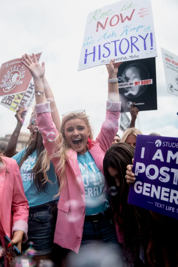 Savanna Deretich, federal government affairs coordinator for Students for Life of America, celebrates the overturn on Roe v. Wade outside of the Supreme Court on June 24, 2022. Credit: Students for Life of America/Kevin Feliciano