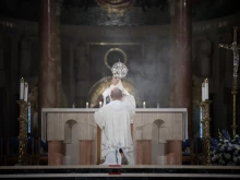 A Dominican friar blesses the faithful with the Eucharist during Benediction at the Dominican Rosary Pilgrimage at the National Shrine of the Immaculate Conception in Washington, DC, on Sept. 28, 2024.