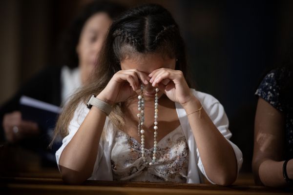 A woman prays the rosary at the Dominican Rosary Pilgrimage at the National Shrine of the Immaculate Conception in Washington, D.C., on Sept. 28., 2024. Credit: Jeffrey Bruno