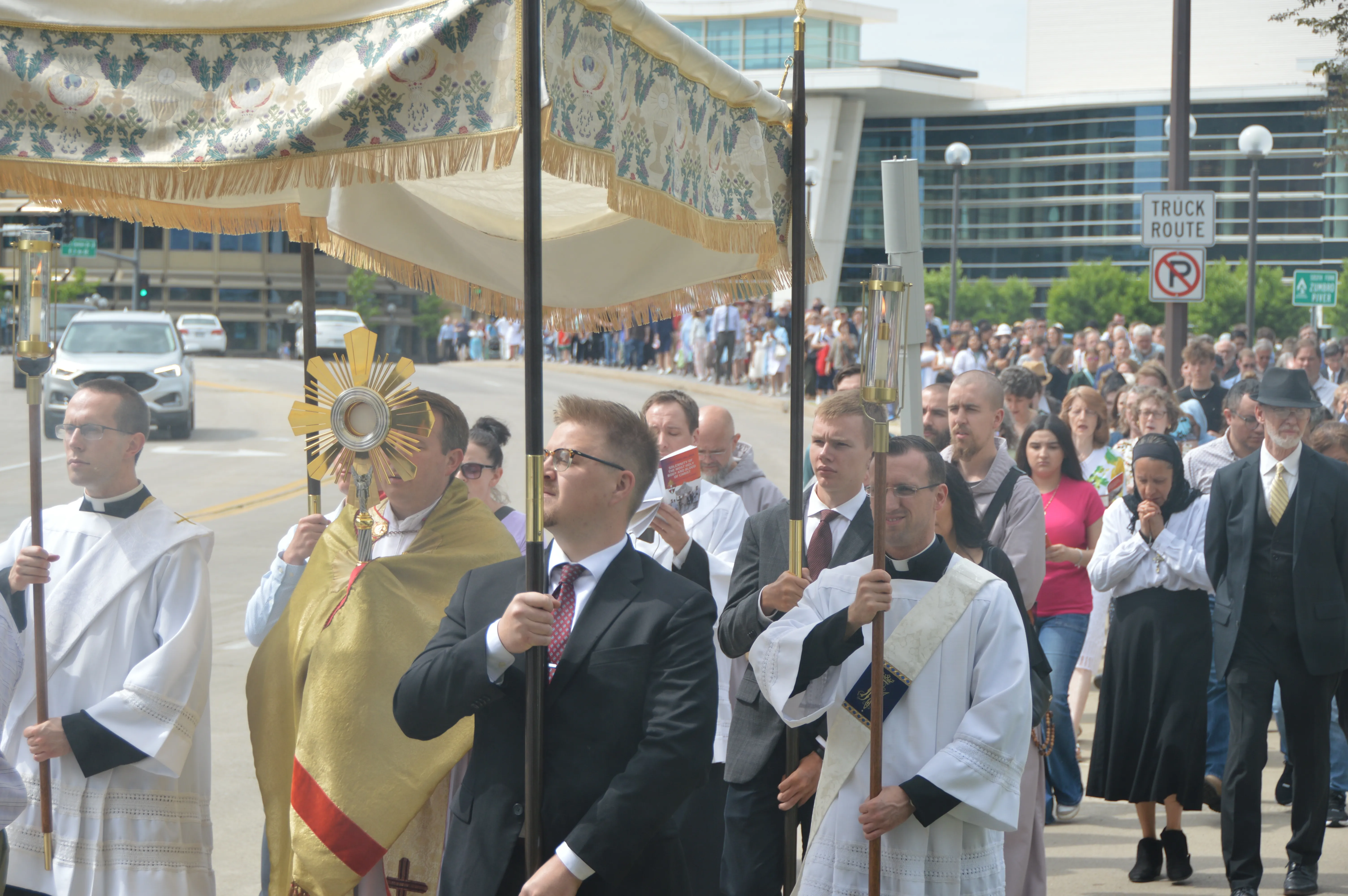 The faithful process behind the Blessed Sacrament across a bridge after leaving the Mayo Civic Center in Rochester, Minnesota, June 2. 2024.?w=200&h=150