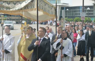 The faithful process behind the Blessed Sacrament across a bridge after leaving the Mayo Civic Center in Rochester, Minnesota, June 2. 2024. Credit: Nick Reller, Winona-Rochester Diocese