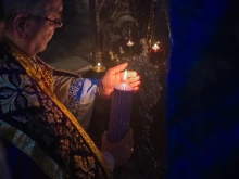 The custos of the Holy Land, Father Francesco Patton, lights the first candle of the Advent wreath at the site of the manger inside the Nativity Grotto on Nov. 30, 2024, during the first vespers of the first Sunday of Advent.