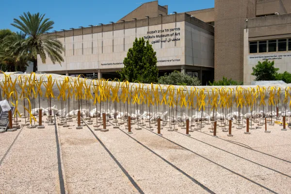 An installation of yellow ribbons symbolizing the campaign for the release of the Israeli hostages held by Hamas is displayed in the square in front of the Tel Aviv Museum of Art, now better known as "The Hostages and Missing Square." Credit: Marinella Bandini
