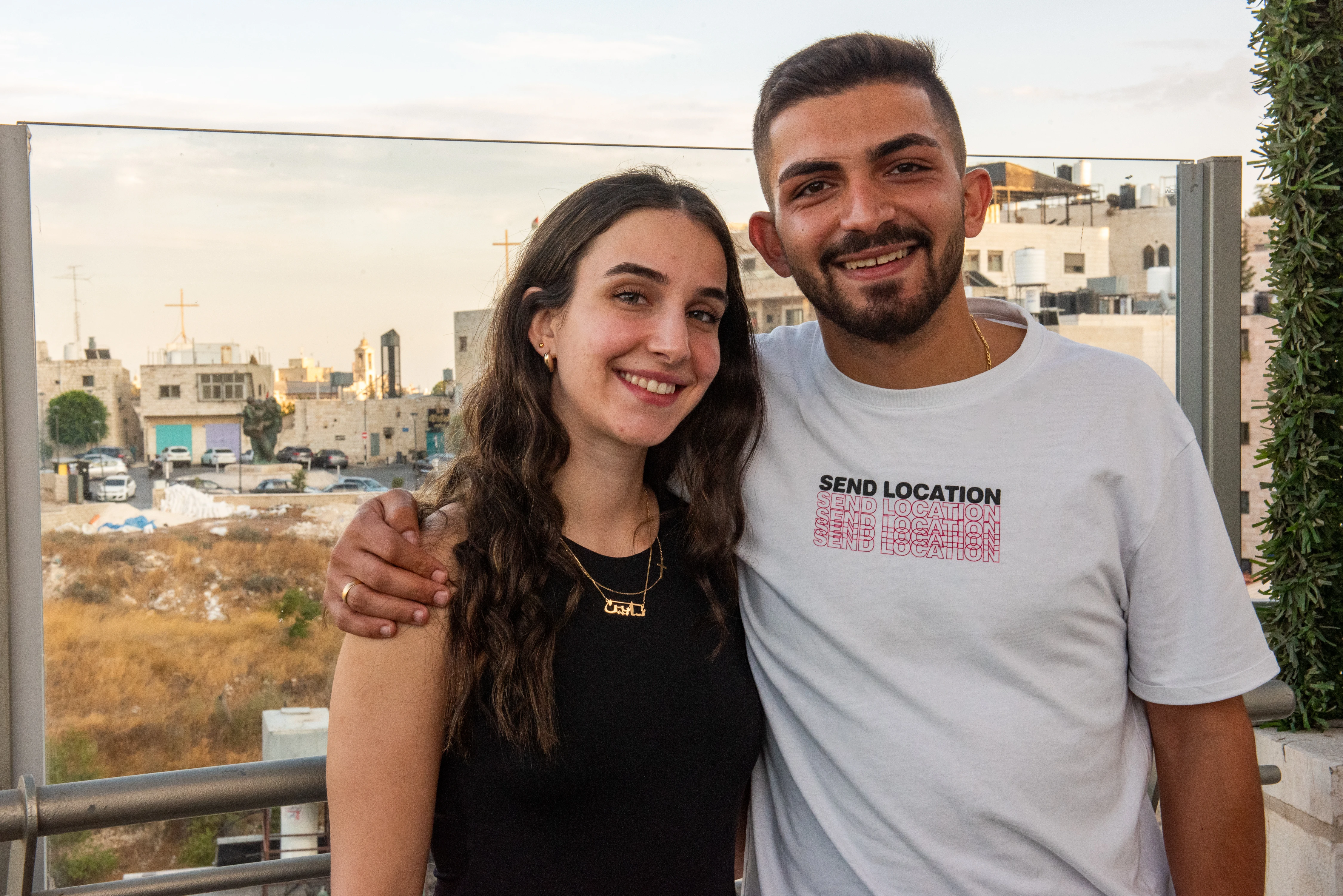 Sabeen Rahil and Elias Johny Al Arja in Bethlehem. In the background behind them is the bell tower of the Church of the Nativity, which stands on the site where Jesus was born.?w=200&h=150