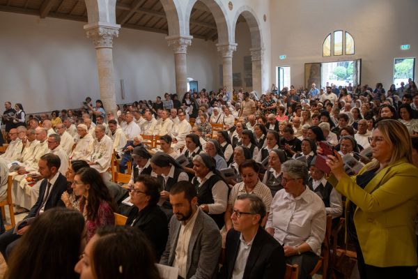 Hundreds of local faithful from Jerusalem and Galilee attend the solemn Mass with the rite of dedication of the altar, marking the reopening of the Church of Our Lady of the Ark of the Covenant in Kiryat Yearim, on Aug. 31, 2024. A hundred years ago, Sister Josephine Rumèbe of the Sisters of St. Joseph of the Apparition wrote about having seen a vision of "a crowd rushing toward the basilica. I saw priests, sisters of our order, and then men and women of the world who were even more pleasing to God than all the others, holy souls shining like stars.” Credit: Marinella Bandini