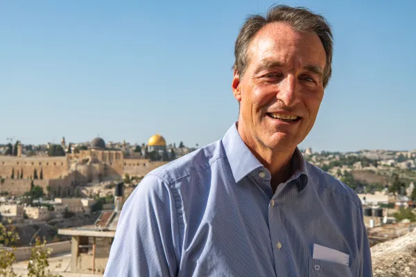 Bernard Thibaud, director of Maison Abraham (Abraham House) in Jerusalem, a pilgrim guest house created by Secours Catholique-Caritas France. In the background, the golden "Dome of the Rock," one of the symbols of Jerusalem, is clearly visible from Maison Abraham. Credit: Marinella Bandini