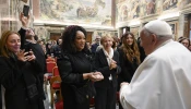 Pope Francis greets artists and participants of the 2024 Vatican Christmas Concert in the Clementine Hall on Dec. 14, 2024.