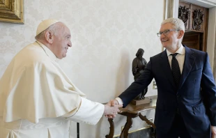 Pope Francis shakes hands with Apple CEO Tim Cook at the Vatican, Oct. 3, 2022. Vatican Media