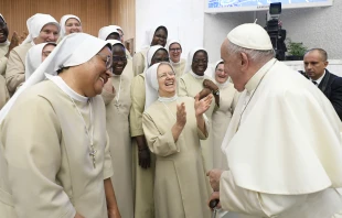 Pope Francis laughs with some religious sisters at his general audience in the Vatican’s Paul VI Hall on Aug. 30, 2023. Credit: Vatican Media