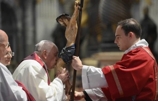 Pope Francis kisses the crucifix at the Liturgy of the Lord's Passion in St. Peter's Basilica on April 7, 2023. Vatican Media