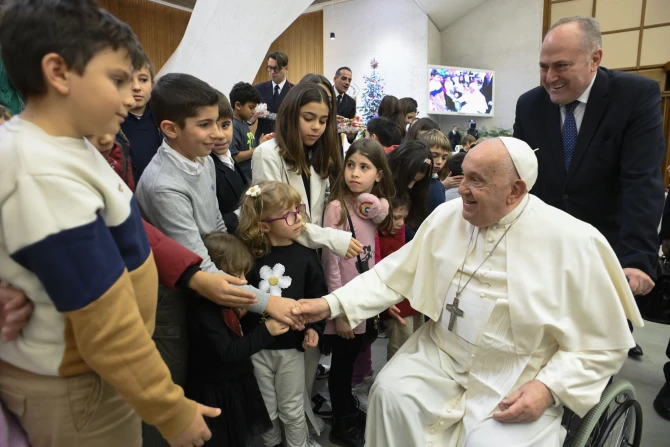 Pope Francis greets children