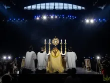 Bishop Andrew Cozzens of Crookston, Minnesota, who spearheaded the U.S. bishops’ initiative of Eucharistic Revival, adores Christ in the Eucharist with tens of thousands of people in Lucas Oil Stadium on July 17, 2024.