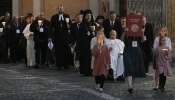 Young people lead a procession in Protomartyrs Square at the Vatican for an ecumenical prayer service on Oct. 11, 2024.