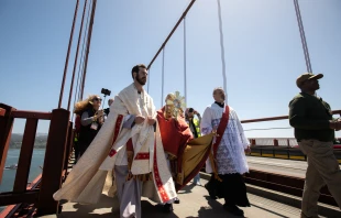 Archbishop Cordileone and the faithful from the Archdiocese of San Francisco process across the Golden Gate Bridge in the historic first eucharistic pilgrimage to the National Eucharistic Congress. Credit: Jeffrey Bruno