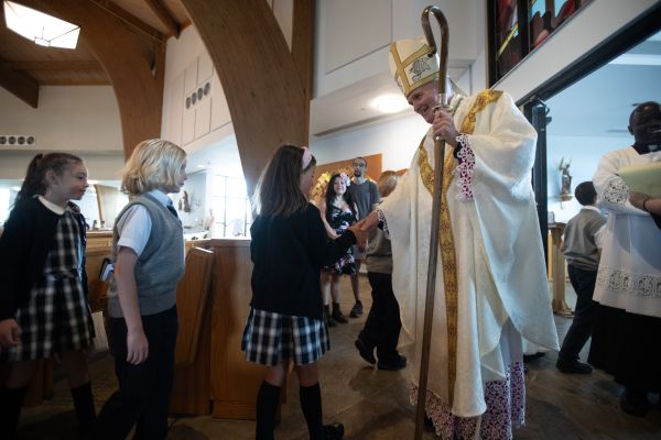 Bishop David O’Connell greets students from the Diocese of Trenton during a stop on the National Eucharistic Pilgrimage at St. Mary of the Pines Church, Manahawkin, New Jersey, May 29, 2024. Credit: Jeffrey Bruno