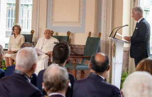 Pope Francis sits next to Queen Mathilde and listens as King Philippe (far right) speaks during a meeting between the pope and dignitaries in the Grand Gallery of Belgium’s Laeken Castle on Friday, Sept. 27, 2024. Credit: Daniel Ibáñez/CNA