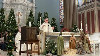 From left to right: Auxiliary Bishop of the Our Lady of the Angels Pastoral Region Matthew G. Elshoff, St. Monica pastor Father Lloyd Torgerson, and Corpus Christi pastor Monsignor Liam Kidney celebrate Mass at St. Monica Church with Corpus Christi’s surviving tabernacle next to the altar on Jan. 12, 2025.