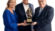 Michael P. Warsaw, chairman and CEO of EWTN Global Catholic Network, presents the 2024 Mother Angelica Award to Curtis and Michaelann Martin, co-founders of the Fellowship of Catholic University Students, on Dec. 12, 2024.