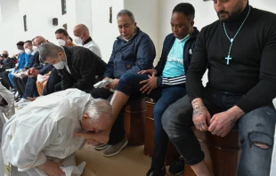 Pope Francis washes the feet of prisoners in Civitavecchia, Italy, April 14, 2022. Vatican Media.