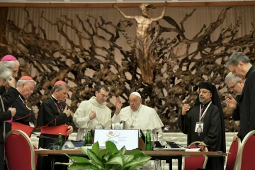 Pope Francis gives a blessing to participants at the conclusion