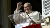 Pope Francis waves to pilgrims gathered in St. Peter's Square for his Angelus address on Nov. 10. 2024.