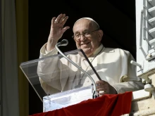 Pope Francis waves to pilgrims gathered in St. Peter's Square for his Angelus address on Nov. 10. 2024.