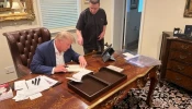 Father Frank Mann is seen with President Donald Trump in an undated photograph.