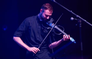 Father Kevin Lenius, a priest from the Diocese of San Angelo, Texas, takes part in the “Concert for Life” playing the electric violin. Credit: JC Orillion