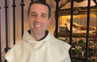 Father Michael-Joseph Paris, OCD, in front of St. Thérèse of Lisieux’s tomb. Credit: Father Michael Joseph/Ascension