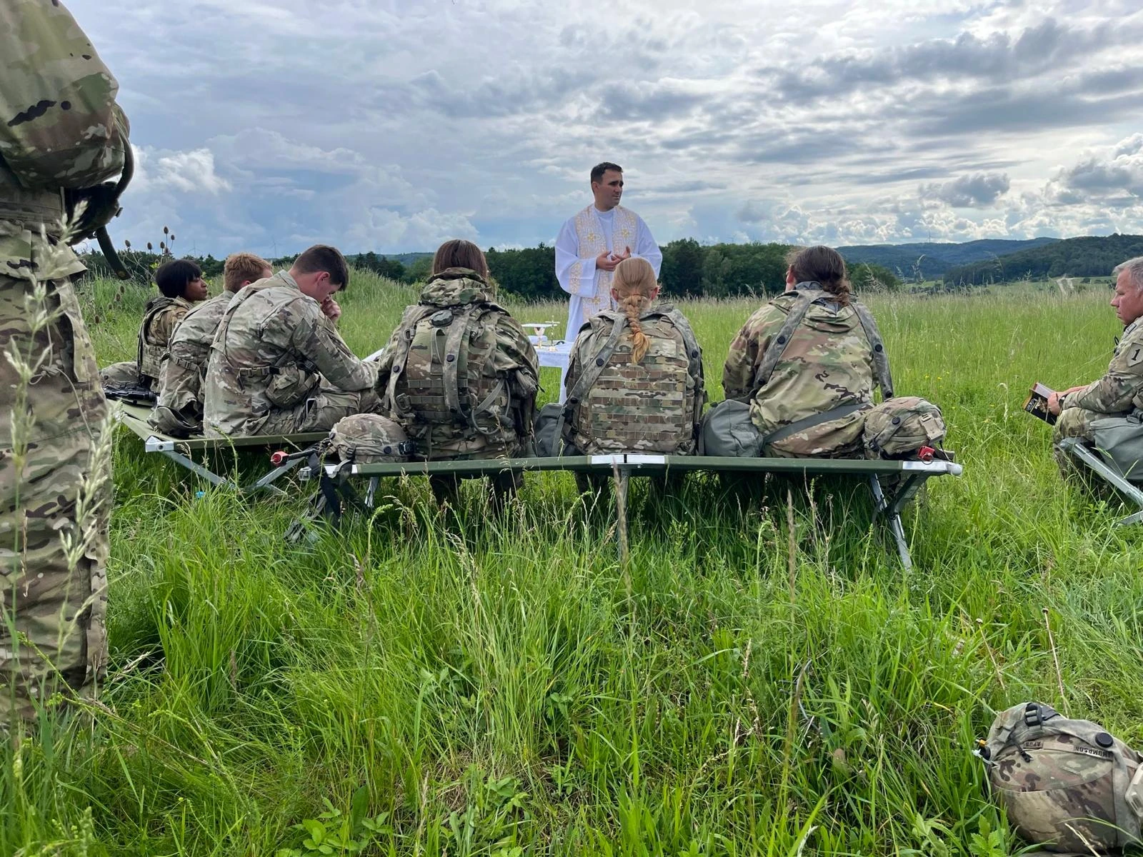 Father Adam Muda, a chaplain for the U.S. Army, celebrates Mass on the field with soldiers while in Germany.?w=200&h=150