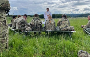 Father Adam Muda, a chaplain for the U.S. Army, celebrates Mass on the field with soldiers while in Germany. Credit: Photo courtesy of Father Adam Muda