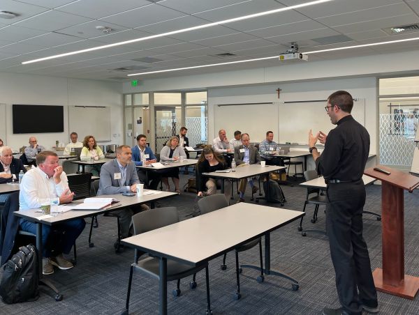 Father Patrick Reidy, CSC, a professor at Notre Dame Law School and faculty co-director of the Church Properties Initiative, conducts a workshop for diocesan leaders on Notre Dame's campus in summer 2023. Credit: Photo courtesy of David J. Murphy/Church Properties Initiative