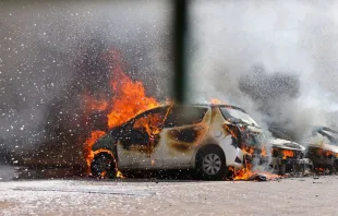 Cars are seen on fire following a rocket attack from the Gaza Strip in Ashkelon, southern Israel, on Oct. 7, 2023. Credit: Ahmad Gharabali/AFP via Getty Images